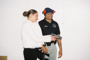 Assisting student with proper weapon handling